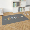 STACKED TRUCKS CHARCOAL Area Rug By Kavka Designs